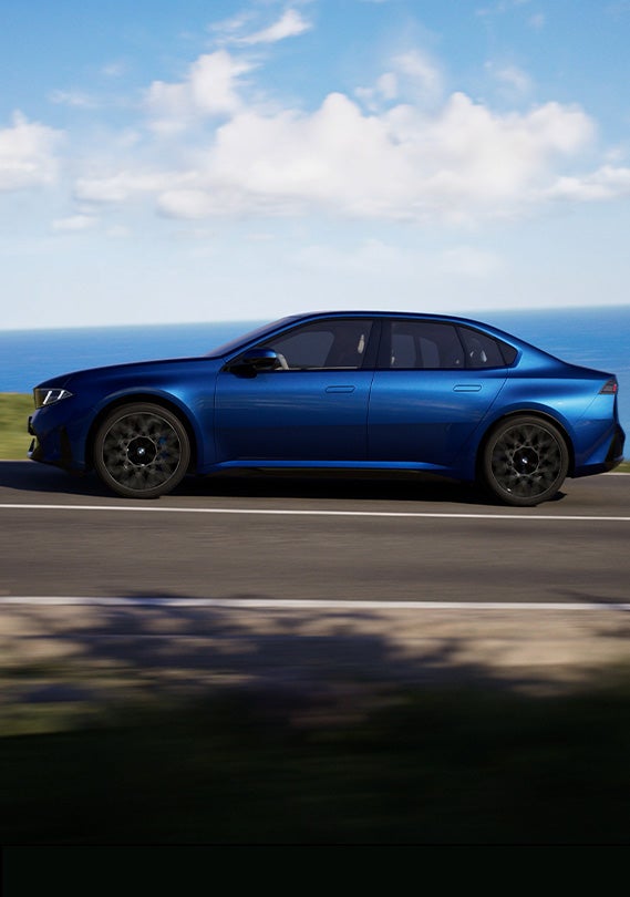 Motion image of BMW i3 driving, side view.