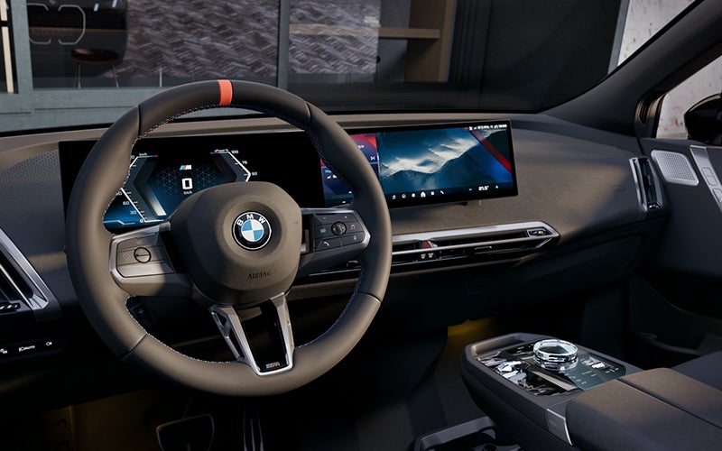 Interior steering wheel and dashboard of the BMW iX M70. | Zeigler BMW in Kalamazoo MI