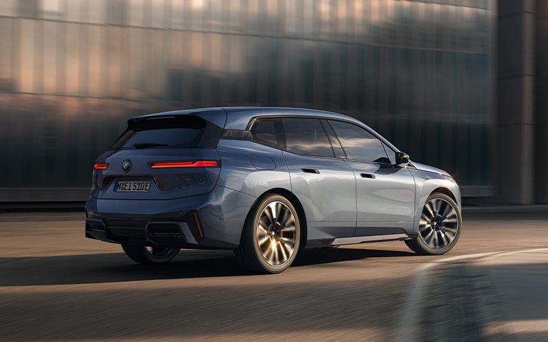 The BMW iX driving with the front wheel turned. | Zeigler BMW in Kalamazoo MI